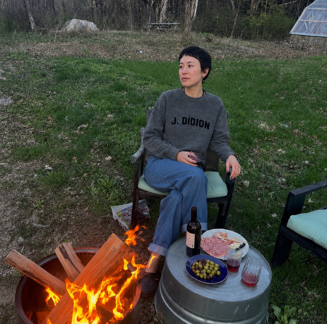 Wearing a Sororitées sweatshirt by the fire